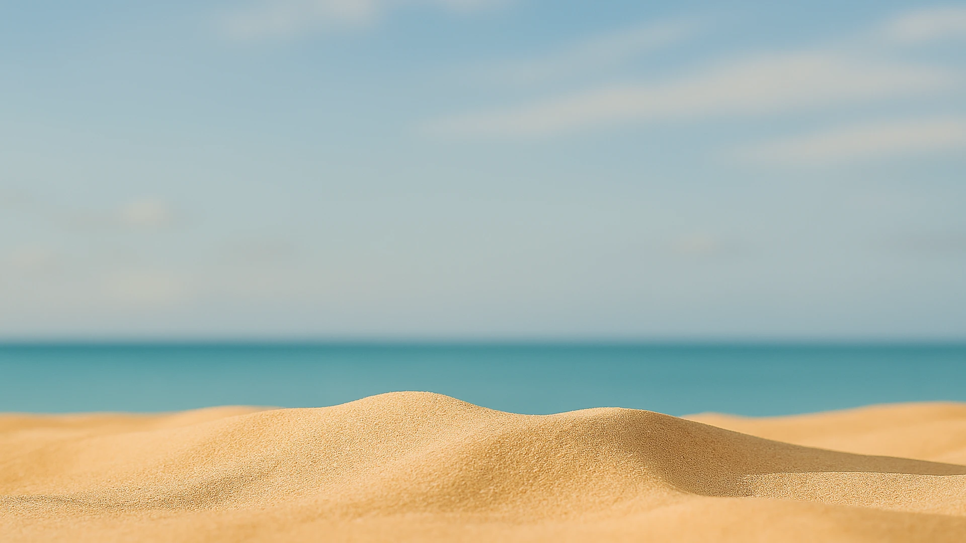 Sand dune with sea and sky background